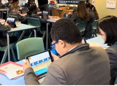 Children playing on Sumdog in class