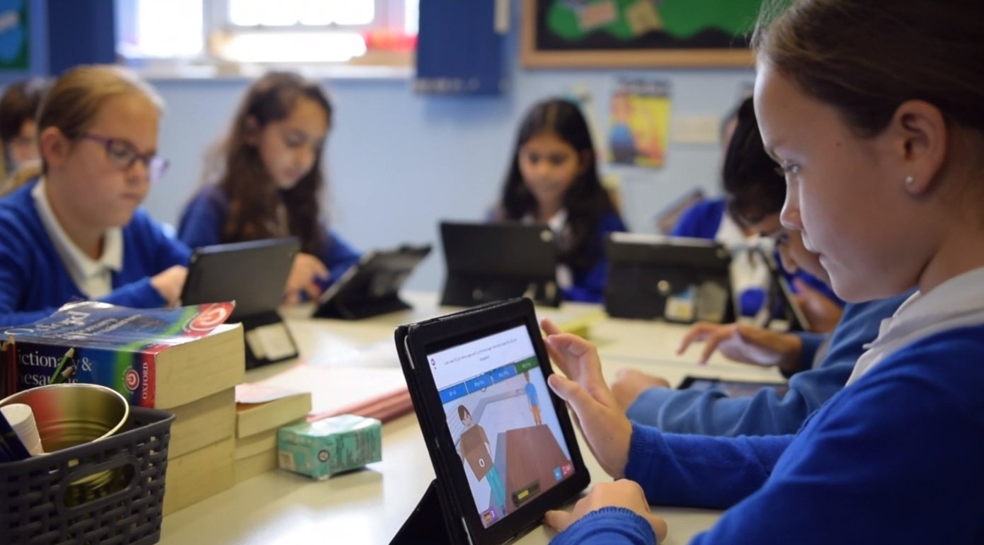 Image of child playing Sumdog game in class 1390x770