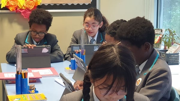 Image of L.E.A.D. children playing Sumdog on iPads