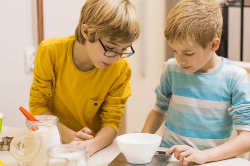 Children measuring ingredients