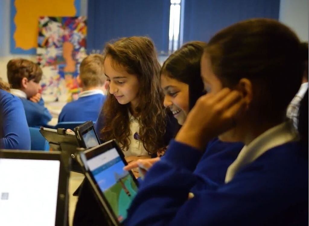 Pupils on laptops playing Sumdog Pupils on laptops playing Sumdog